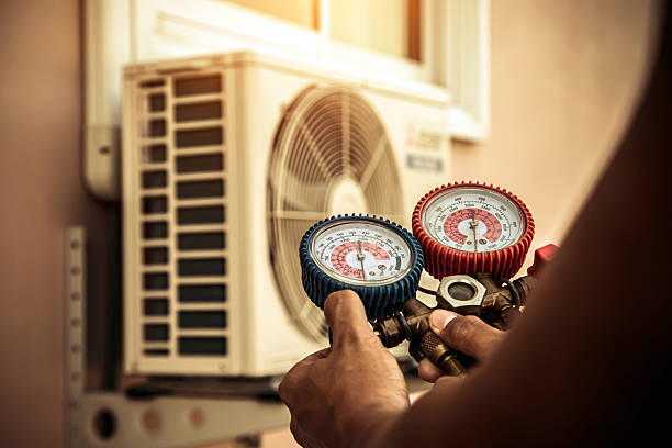 Professional Air Conditioning Service technician working in Satsuma, AL